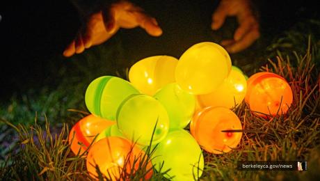 pile of glowing plastic eggs with hands